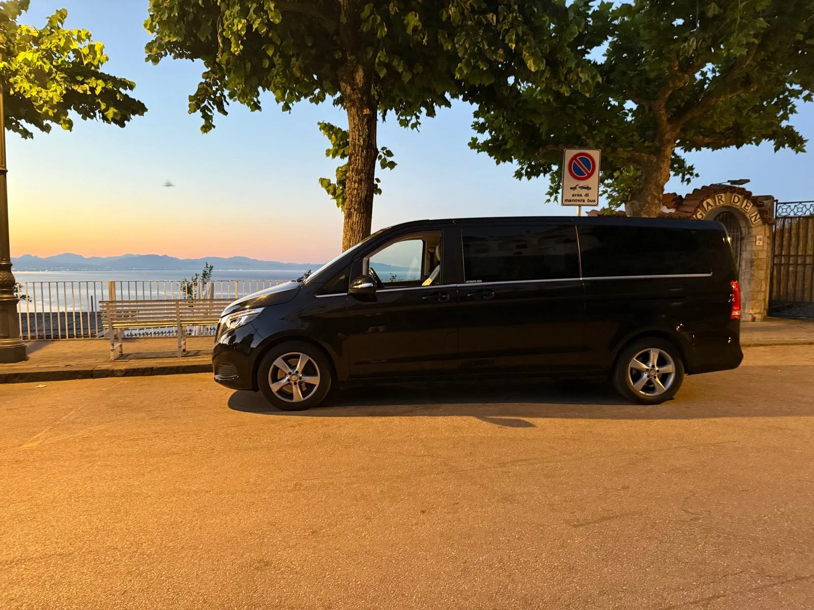 Mercedes luxury van for private driver service on the Amalfi Coast at sunset
